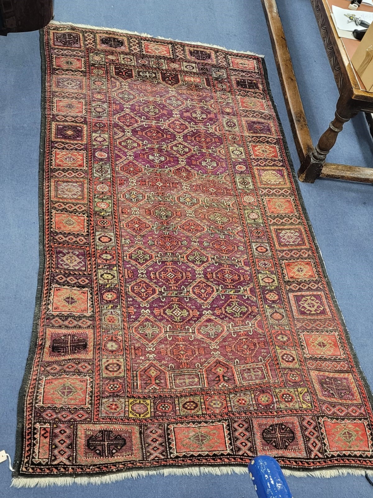 A Turkish geometric multicoloured rug, 280 x 150cm